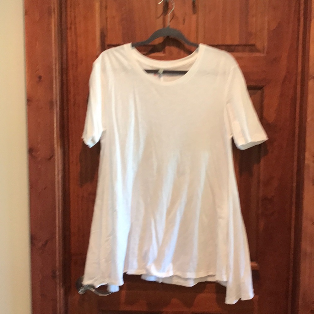 Embellish white tee with a swing cut
